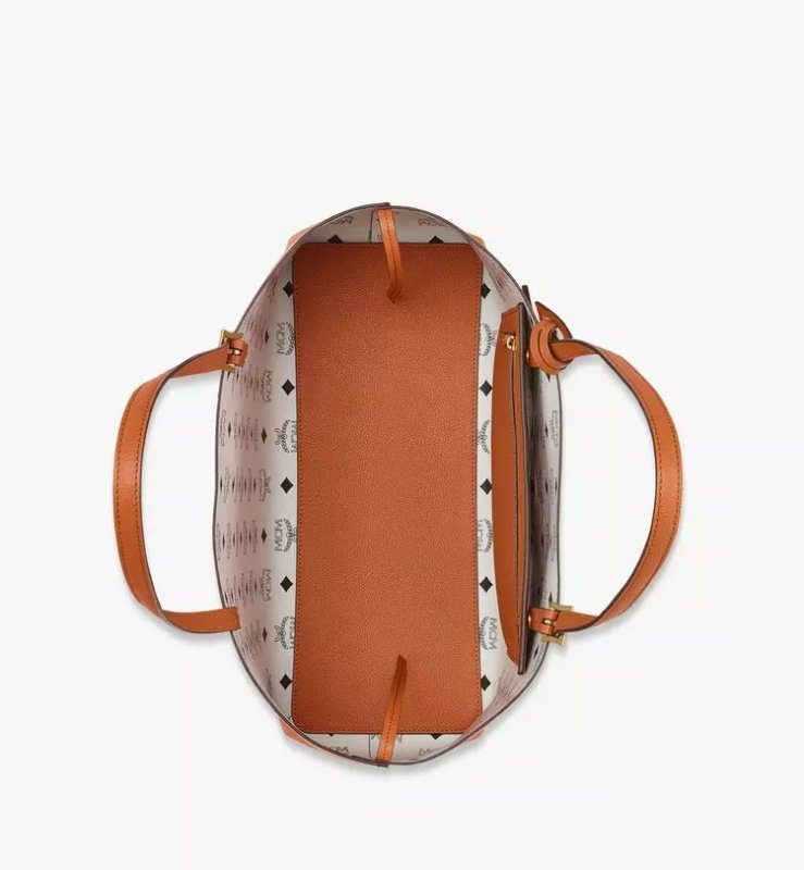 MCM HIMMEL SHOPPER IN EMBOSSED LOGO LEATHER - COGNAC