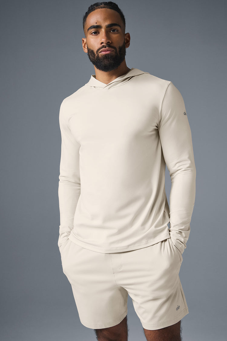 ALO YOGA CONQUER REFORM LONG SLEEVE WITH HOOD - BONE