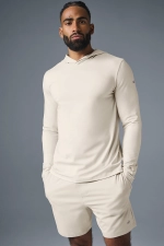 ALO YOGA CONQUER REFORM LONG SLEEVE WITH HOOD - BONE