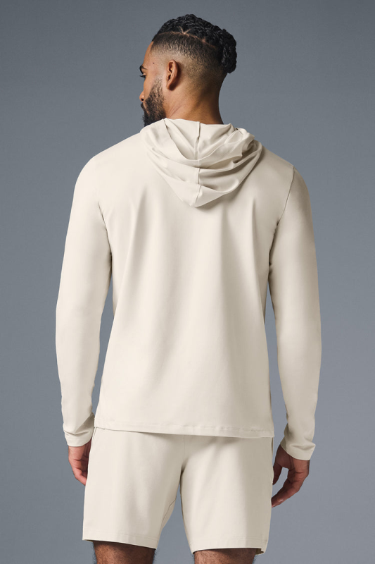 ALO YOGA CONQUER REFORM LONG SLEEVE WITH HOOD - BONE