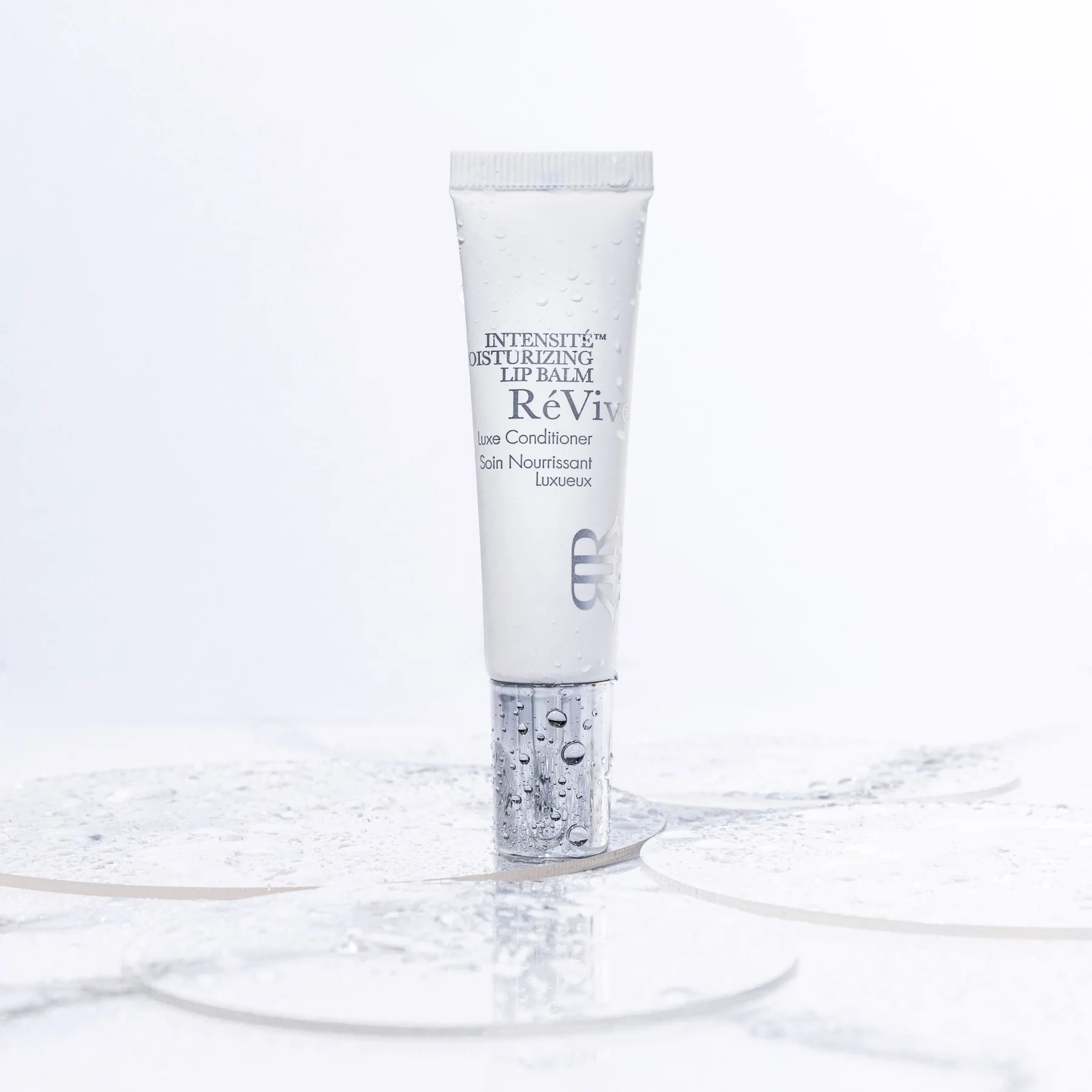 REVIVE SKINCARE INTENSITé MOISTURIZING LIP BALM / LUXE CONDITIONER POIDS NET 10 G / NET WT. 0.33 OZ.
