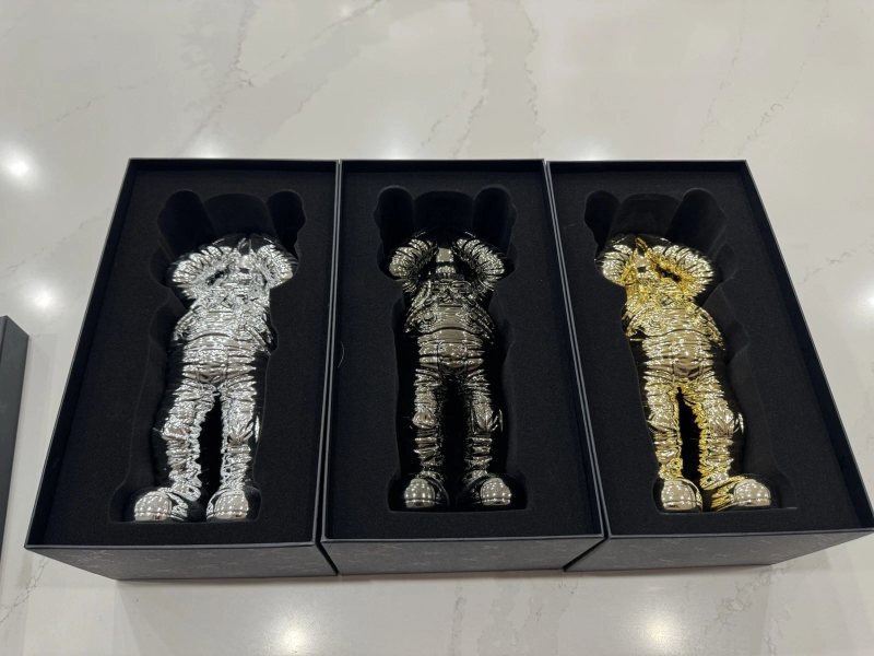 KAWS HOLIDAY SPACE FIGURE SET (GOLD SILVER & BLACK)- COMPLETE SET OF 4 FIGURES