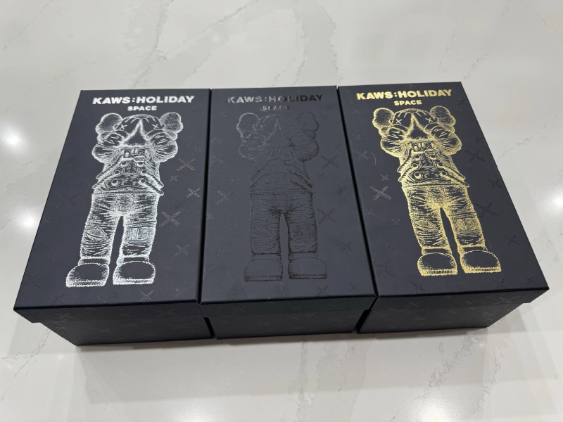 KAWS HOLIDAY SPACE FIGURE SET (GOLD SILVER & BLACK)- COMPLETE SET OF 4 FIGURES
