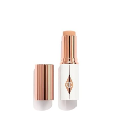 CHARLOTTE TILBURY UNREAL SKIN TINT SHEER GLOW HYDRATING FOUNDATION STICK - CREAM MAKEUP