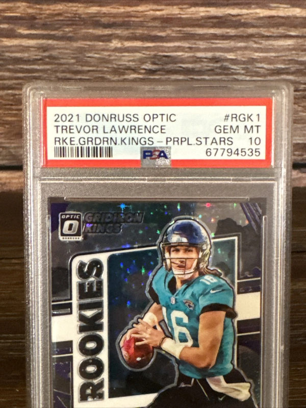 DONRUSS OPTIC GRIDIRON KINGS ROOKIE PURPLE TREVOR LAWRENCE PSA 10 #/25 2021