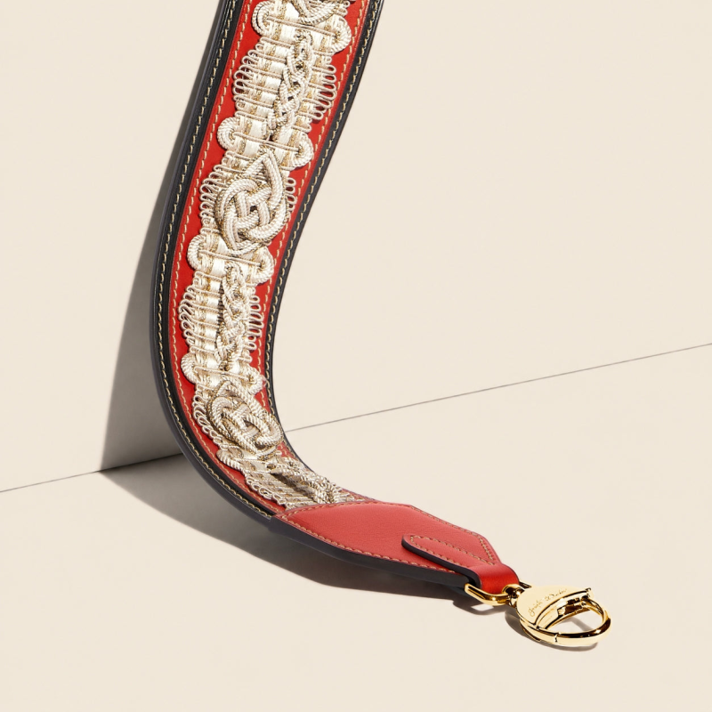 JOSEPH DUCLOS DIDEROT PASSEMENTERIE STRAP IN COQUELICOT HéRITAGE LEATHER PALLADIUM PLATED BRASS COQUELICOT & BLACK,